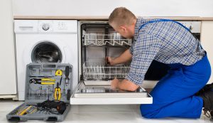 Man Repairing Dishwasher
